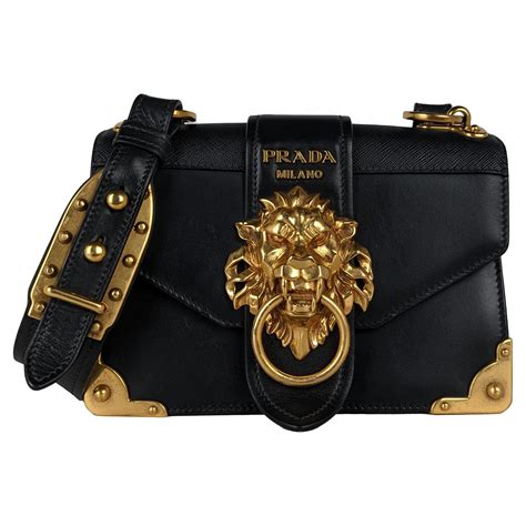 prada white black gold lion purse|Prada black purse used.